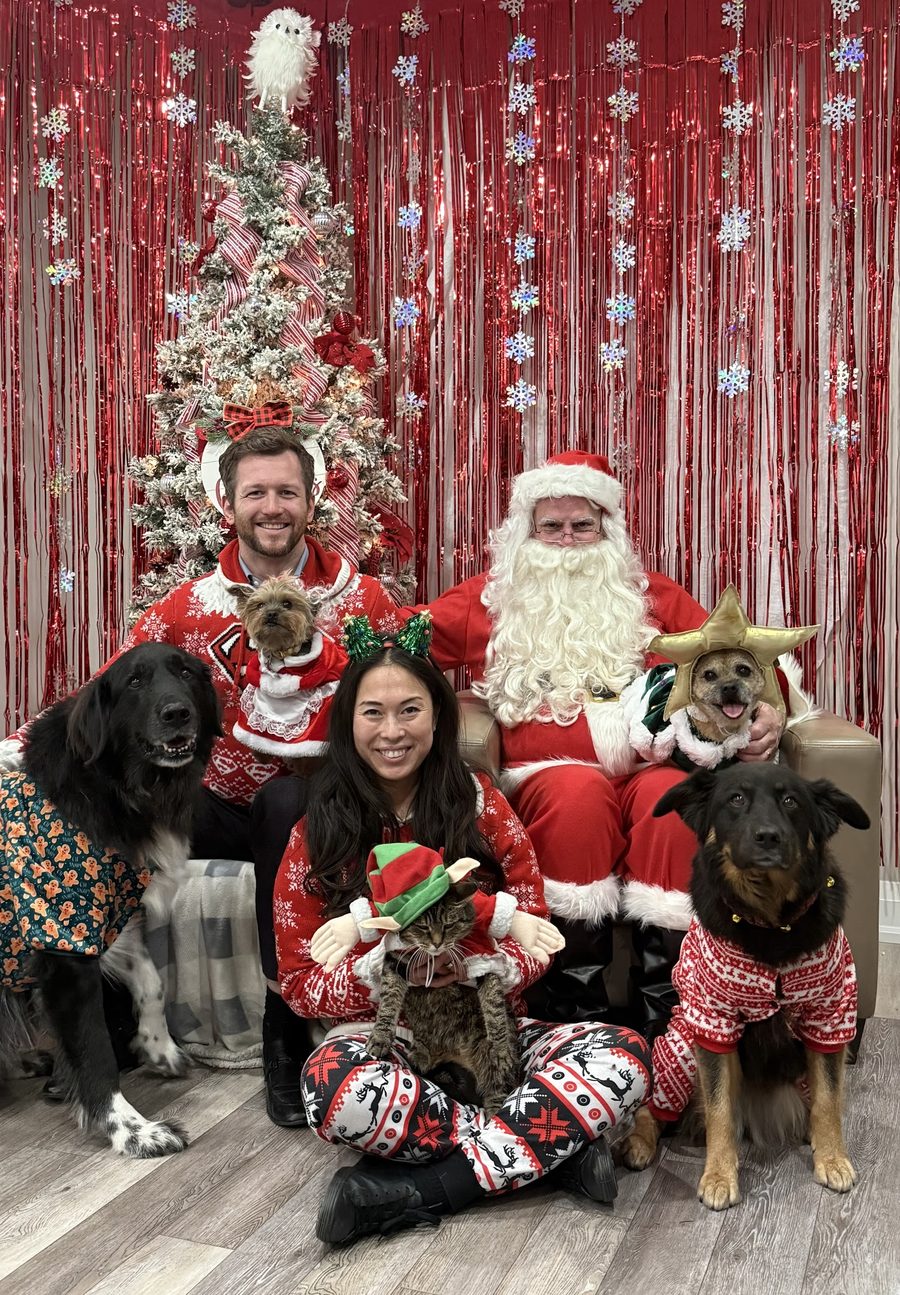 A pet posing with Santa at Mac Animal Clinic